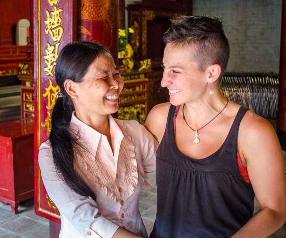 Ashlie and a woman she met in the temple exchanging a hug and a smile