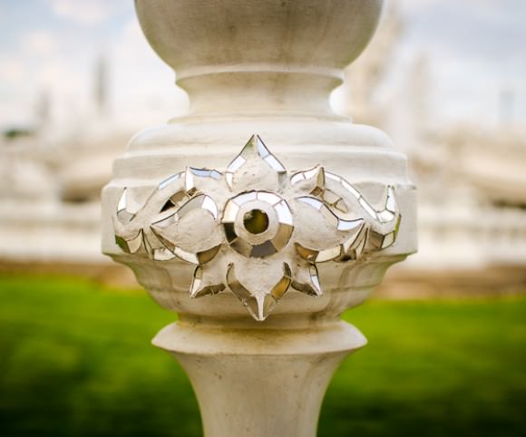 Detailed shot of the fence surrounding the white temple in Chiang Rai, Thailand